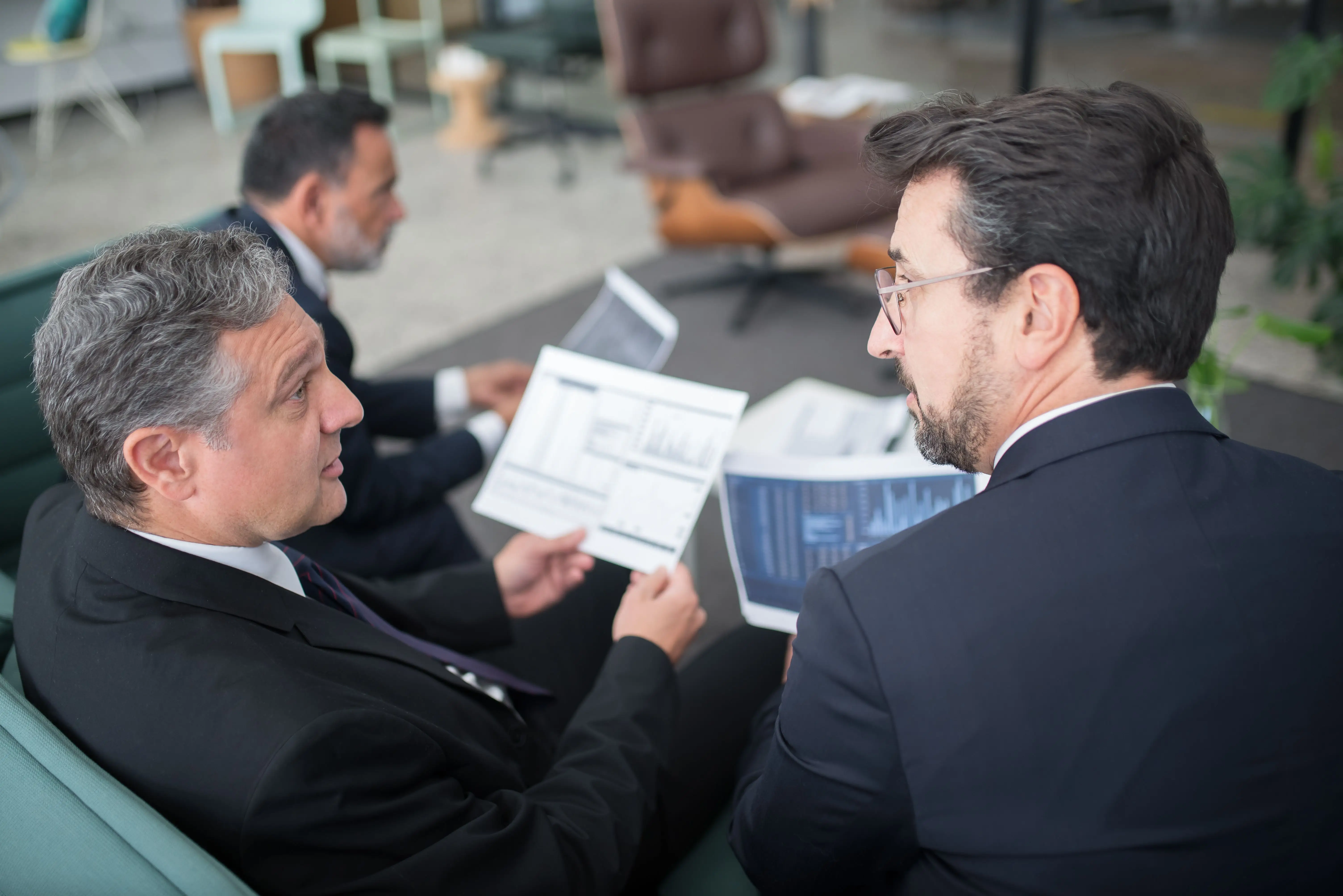 Advisor meeting with clients to discuss wealth preservation strategy